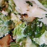 Caesar · hearts of romaine, croutons, and asiago with the house caesar dressing (made with pasteurize...