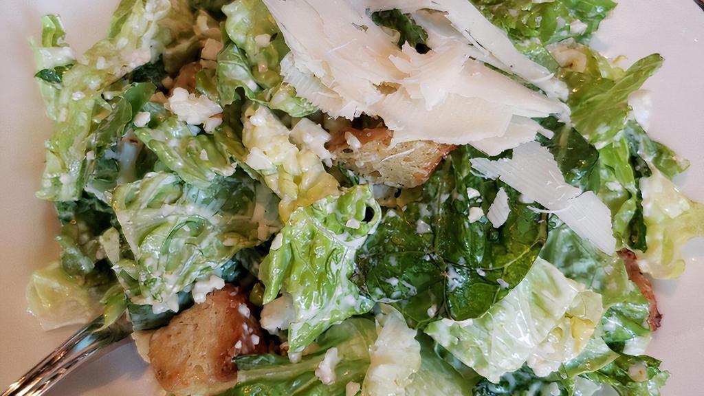Caesar · hearts of romaine, croutons, and asiago with the house caesar dressing (made with pasteurized egg)
