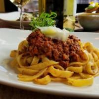 Bolognese Toscana · slow simmered red wine-herb Tuscan beef ragu with house made fettuccine (or with wild boar b...
