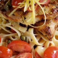 Asiago Piccata · herb marinated chicken breast finished with lemon zested-garlic, served over fresh fettuccin...