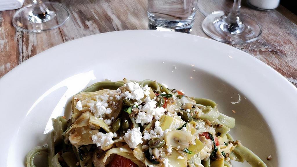 Mediterraneo · house-made spinach fettuccine with fresh tomato, artichoke hearts, capers, garlic, red chile, and basil tossed in olive tapenade, finished with crumbled feta. Spicy - mild upon request