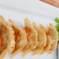 Pot Stickers · 8 pieces. Made with veggies, or chicken and veggies, served with spicy ginger soy sauce.