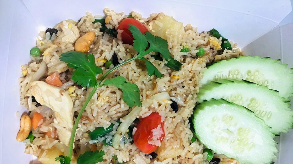 Spicy Fried Rice · Chili, bsil, onions, and egg, topped with cucumber, tomatoes, and cilantro.
