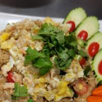 Crab Fried Rice  · delicious Thai fried rice with crab meat, egg, pea, carrots, onion top with cucumber, tomato...