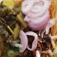 Khao Soi (Curry Noodles) · Northern style curry noodles with lettuce, pickle, shallots, bean sprouts, cilantro, egg noo...