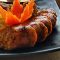 Sai Aua · Our northern style spicy pork sausage served with side of cabbage and sticky rice