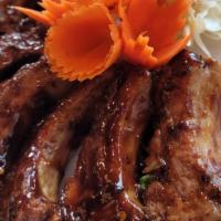 Baby Pork Rib  · our homemade marinate baby pork rib at your choice of spicy or not spicy sauce with sticky r...