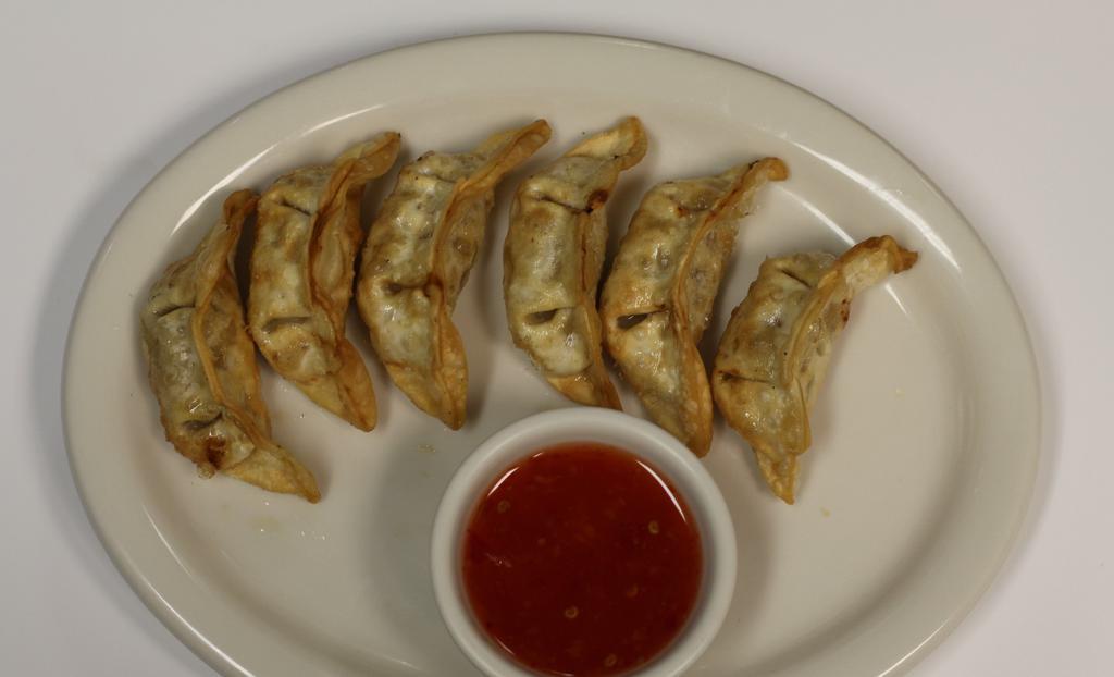 Gyoza (6) · Ground pork, ginger, onions, and celery wrapped in wonton and fried, served with sweet chili sauce.