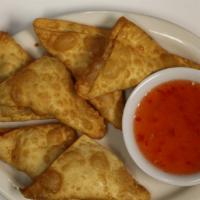 Cream Cheese Wonton (6) · Imitation crab meat and cream cheese in wonton wrap, served with sweet chili sauce.
