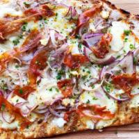 Belgian Countryside · Flammkuchen. Sour cream, muenster cheese, crispy prosciutto, red onion and chives.