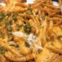 Yellow Fries · a pile o’ fries topped with melted cheddar and jalapeños.