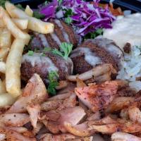 Mf Shawarma Plate · Shawarma grilled with onion, tomatoes, and our house sauce and drizzled with tahini sauce on...