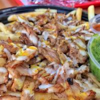 Mf Shawarma Fries · Shawarma grilled with onions, tomatoes, and our house sauce on top of crispy fries drizzled ...