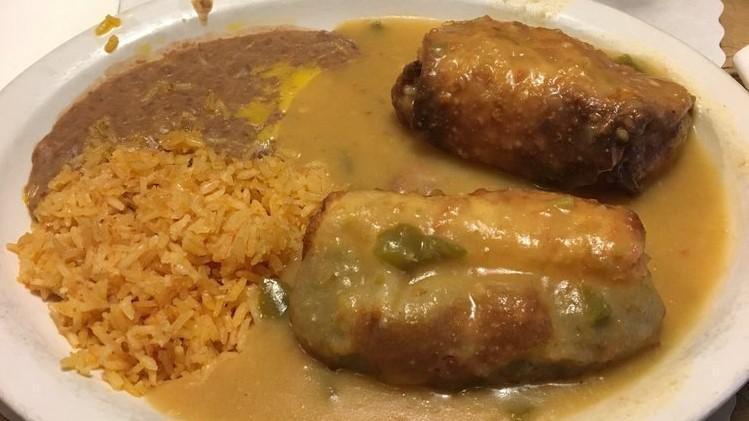 Chile Relleno Plate · 2 rellenos stuffed with cheese, smothered with red or green chile, Spanish rice, refried beans, and 2 tortillas upon request.