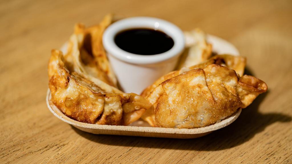 Chicken Gyoza (6) · Six pieces of our chicken gyoza served with house sesame sauce.