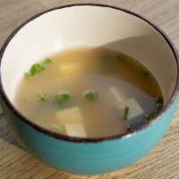Miso Soup · Traditional Japanese soup with a deep umami flavor enhanced with tofu, fresh green onion and...