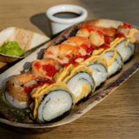 Dragon Breath Roll* · Tempura roll with cream cheese and krabstik, topped with garlic shrimp, Sriracha, spicy mayo...