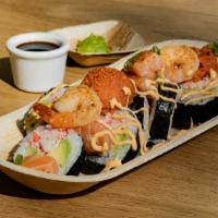 The Ocean Bounty Roll* · Avocado, cucumber, & krabstik topped with spicy tuna, garlic shrimp, fresh salmon, spicy may...
