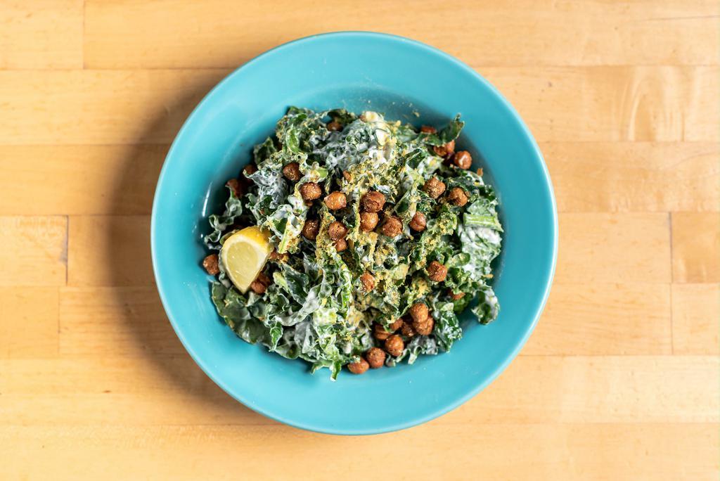 Kale Caesar Salad · Vegan. Made without gluten. House made Caesar dressing, roasted chickpeas, nutritional yeast, lemon.