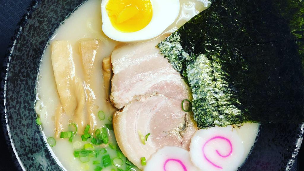 Miso Ramen · Ramen noodles, pork charsu, naruto (fish cake), soft boil egg, mushrooms, green onion, and dry seaweed.