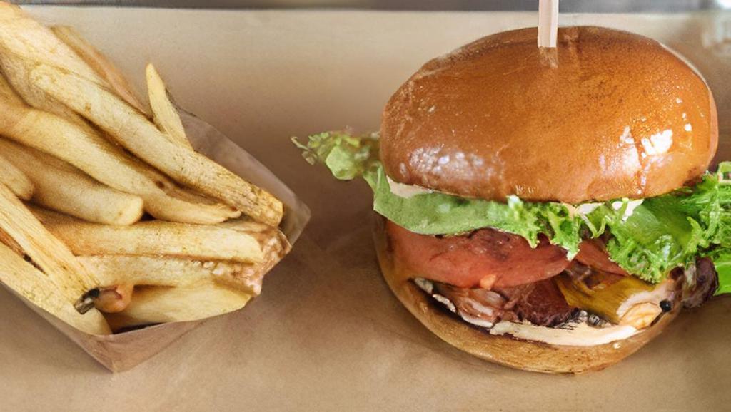 Bacon Cheeseburger · Applewood smoked bacon, lettuce, tomato and Flippin' sauce with melted aged cheddar. Served with French Fries.