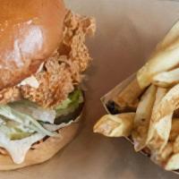 Crispy Chicken Sandwich · Crispy chicken breast, Flippin' sauce, lettuce, and pickles. Served with french fries.