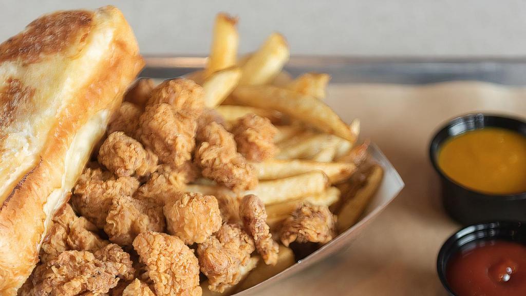 Chicken Bites · Served with Southern BBQ bread, boneless, crispy popcorn chicken. Your choice of dipping sauce. Served with French Fries.
