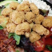 Crispy Chicken Salad · Organic lettuce, crispy chicken, avocado, bacon, bleu cheese, tomatoes and choice of dressing.