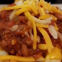 Chili Cheese Fries · House-made chili, aged cheddar queso, and shredded cheese.