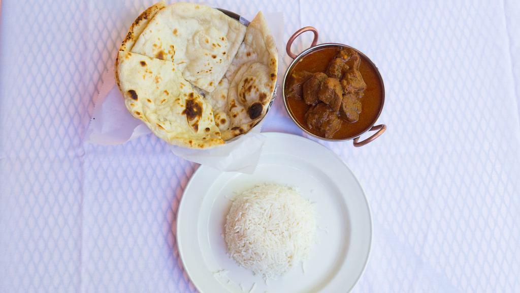 Lamb Curry · Boneless lamb cooked in a mild curry sauce. Served with rice.