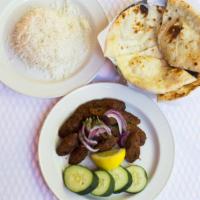 Tandoori Seekh Kabab · Ground lamb mixed with herbs & spices. Served with rice.