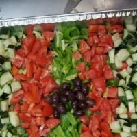 Greek Salad · Romaine lettuce, iceberg, tomato, cucumber, onions, olives.