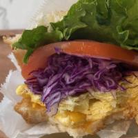 S O S · Toasted brioche bread, green leaf lettuce, tomato, shredded red cabbage, scrambled eggs with...