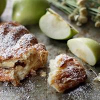Apple Turnover (Each) · A favorite any time of day featuring roasted Washington apples wrapped in croissant dough.
