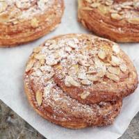 Almond Pinwheel · Our flaky cornetto dough layered with frangipane—a velvety almond cream—rolled into a pinwhe...