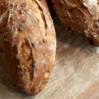 Apricot Nut Loaf (15 Oz) · Our light sourdough with dried apricots, roasted walnuts and pecans. Slightly sweet.