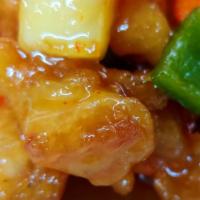 Orange Chicken · Deep fried tempura battered pieces of white meat chicken, green peppers, pineapple chunks an...