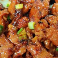 Teriyaki Chicken · Sliced chicken marinated in our sweet teriyaki sauce topped with green onions and served on ...
