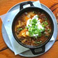 Chili · Our classic meat chili with black beans. topped with cheddar cheese, sour cream & scallions.