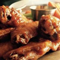 Wings - Ten · Ten fried jumbo chicken wings served naked or with tossed in choice of one wing flavor.