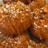 Butterfinger Bites · Mini cake donuts, drizzled with caramel sauce & sprinkled with Butterfinger candy bits & pow...