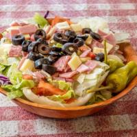 Antipasto Salad · Fresh iceberg lettuce, tomatoes, and cucumbers with ham, salami, provolone cheese, black oli...