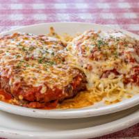 Chicken Parmigiana Pasta · Baked chicken breast smothered with marinara sauce and mozzarella. Served with a side of spa...