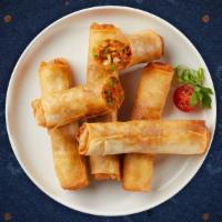 Veggie Egg Rolls · (4 Pieces) House-made vegetable egg roll stuffed with cabbage, carrots, and glass noodles, s...