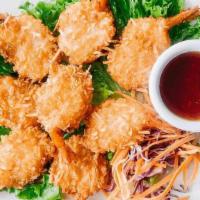 Coconut Prawns · Coconut battered prawns deep fried to golden brown, served with plum sauce