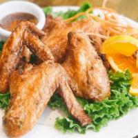 Chicken Wings · Marinate in spices, garlic, pepper, soy and oyster sauce. Golden brown deep fried and served...