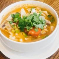 Tom Yum Cup · Thai style hot and sour soup in clear broth with mushrooms and tomatoes, a touch of lemon gr...