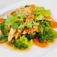 Garlic · Stir fried meat with garlic sauce on a bed of steamed broccoli, carrots, and snow peas, topp...