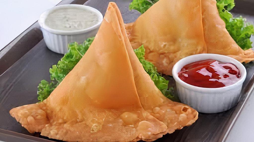 Samosas (2 Pieces)  · Fried pastry filled with a spicy vegetable medley served with tamarind sauce.