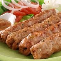 Seekh Kabab (4 Pieces) · Grilled minced beef mixed with indian spices prepared in a clay oven.